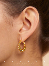 wearing Emery Gold Hoops